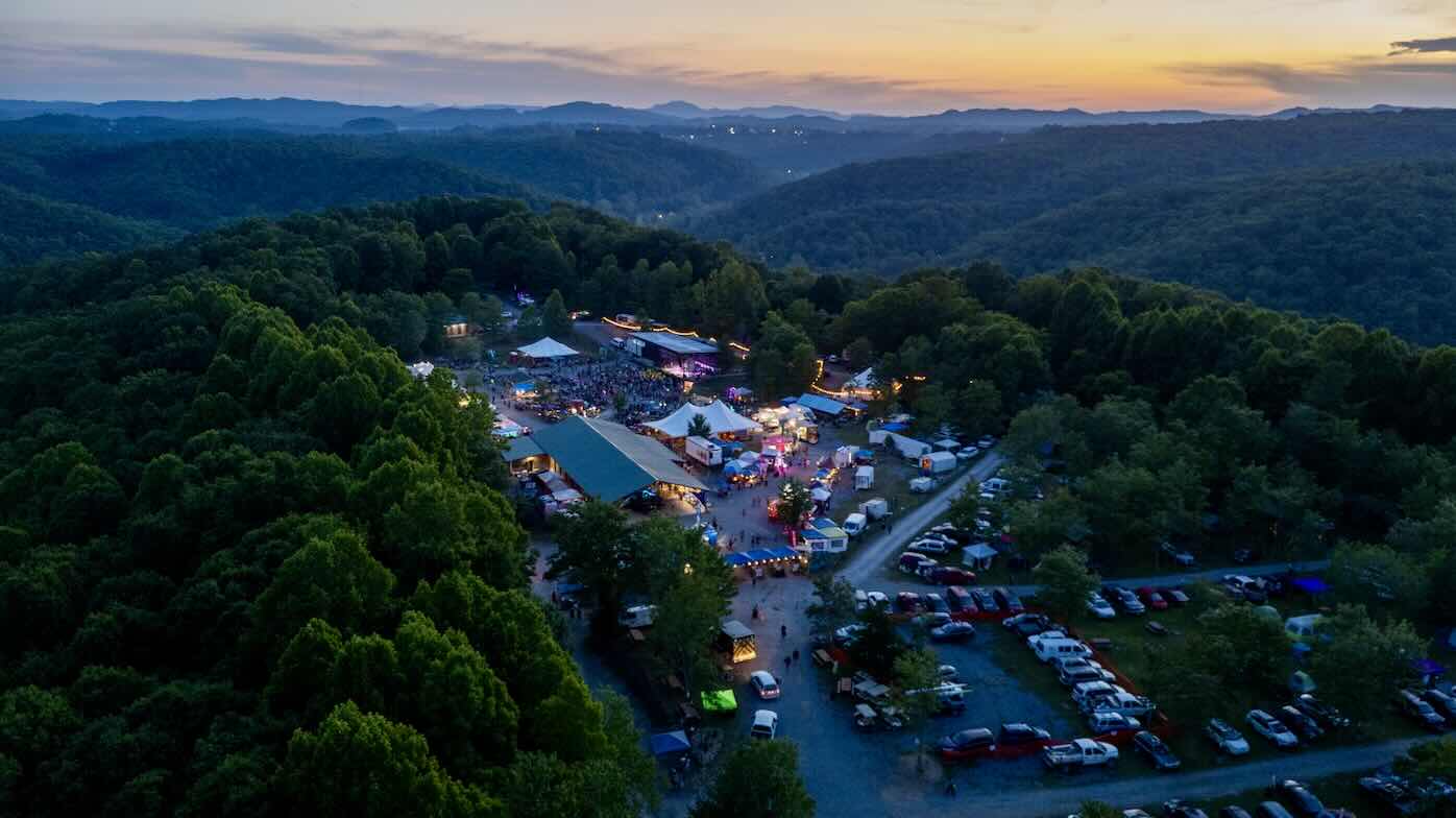 drone shot at sunset of the festival grounds at ace adventure resort during mountain music festival 2026