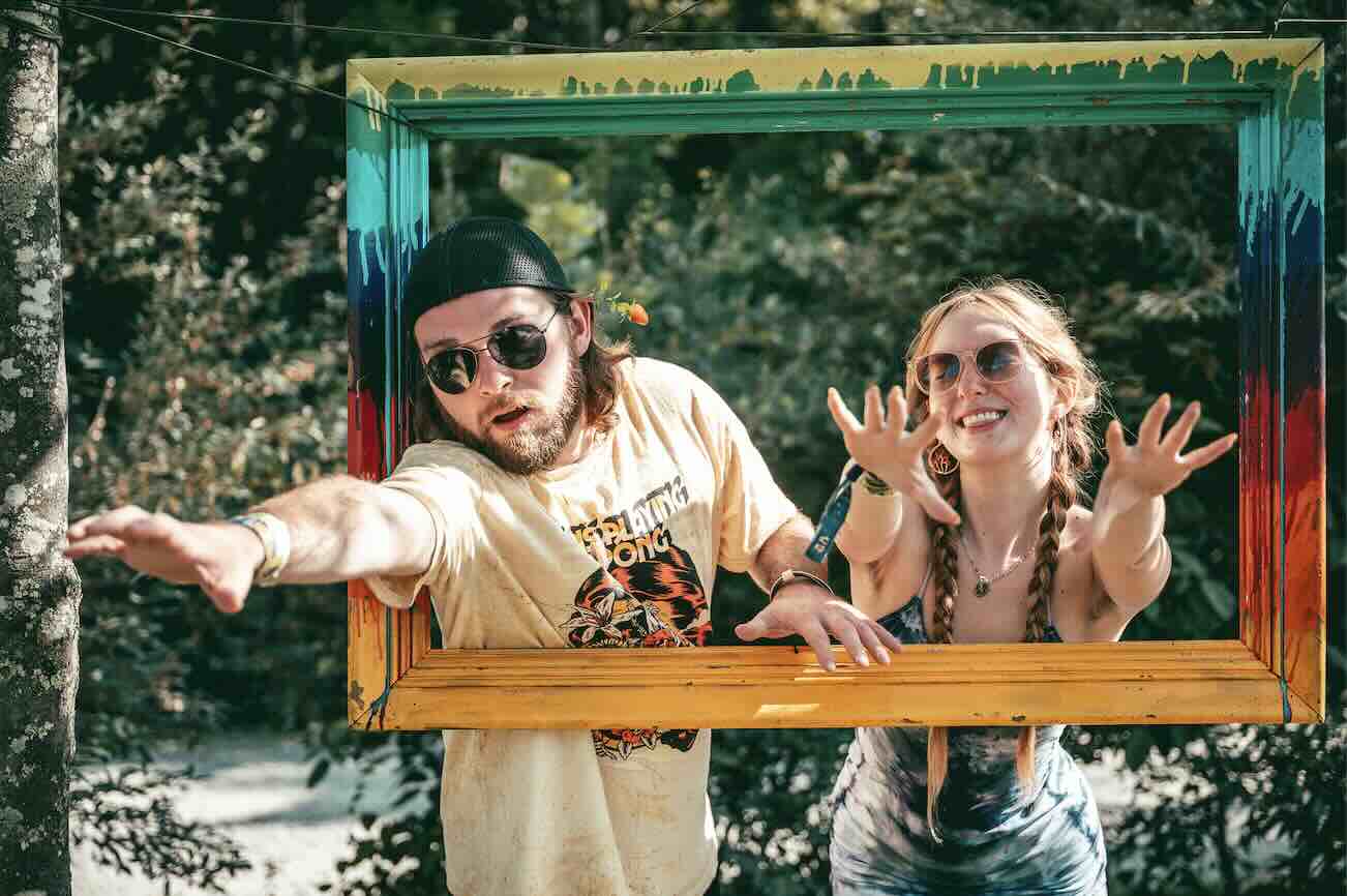 couple reaching thru picture frame at domefest 2025