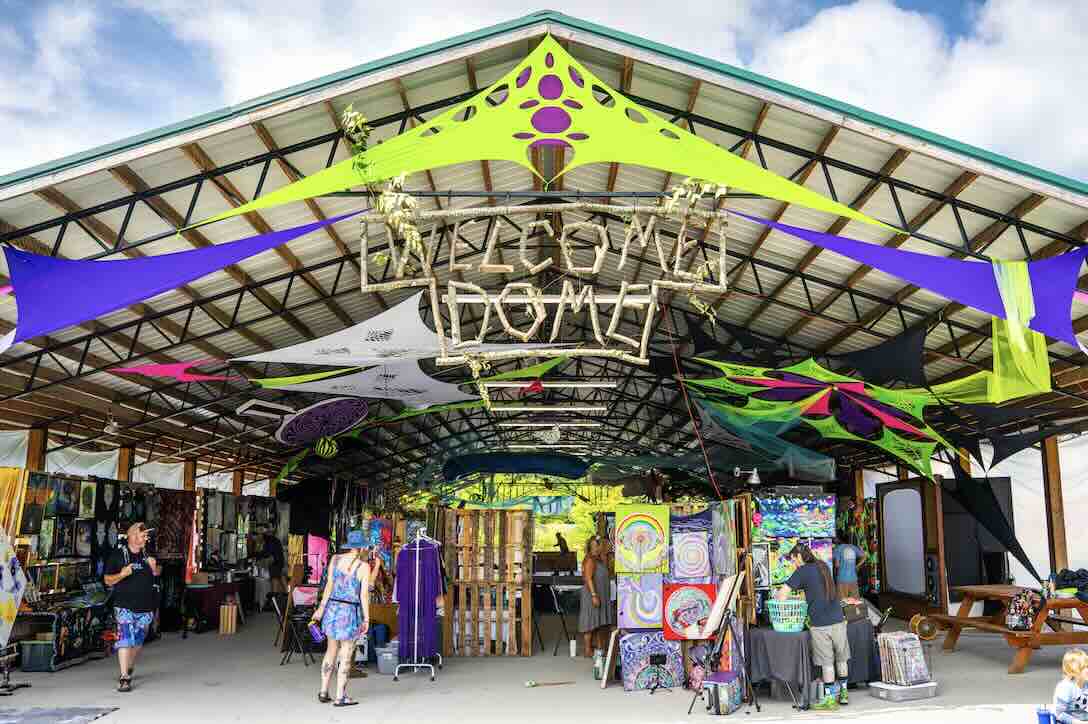 front of the art gallery with welcome dome sign at domefest 2026 in the new river gorge